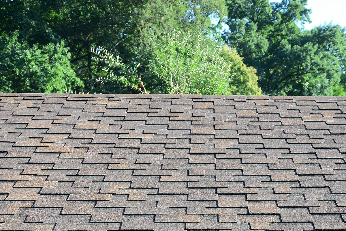 Energy-efficient roof shingles work by reducing heat absorption and lowering cooling demands